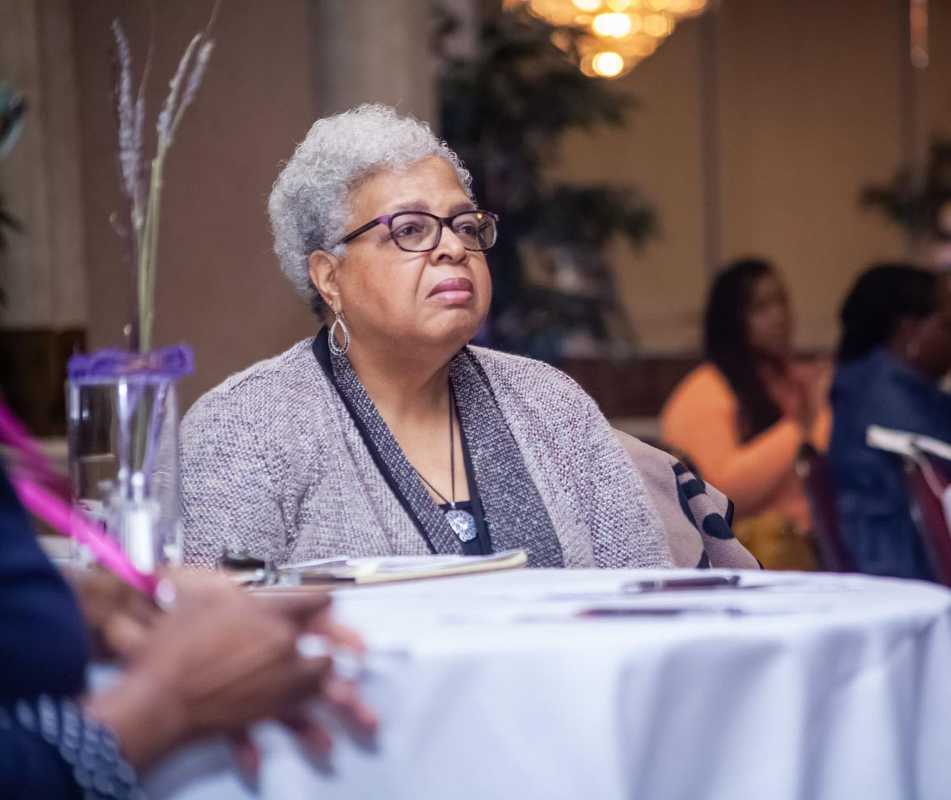 Elderly woman enjoy Dr. Smiths seminar on long term care.